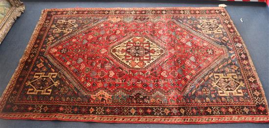 An Iranian red ground rug, 165 x 113cm